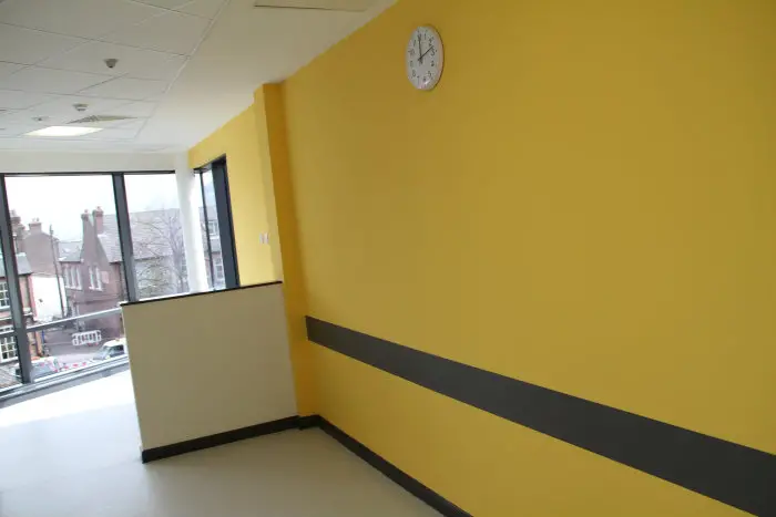 The first floor, colour-coded yellow, contains the audiology, outpatients and blood test services