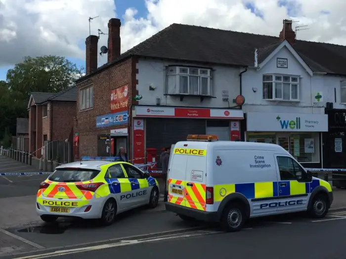 Police outside Timperley Post Office on the day of the attack