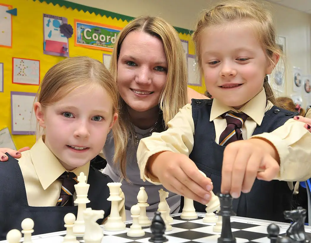 Sarah Hegarty with Loreto Prep girls Aine Pegler (left) and Maria Denisova