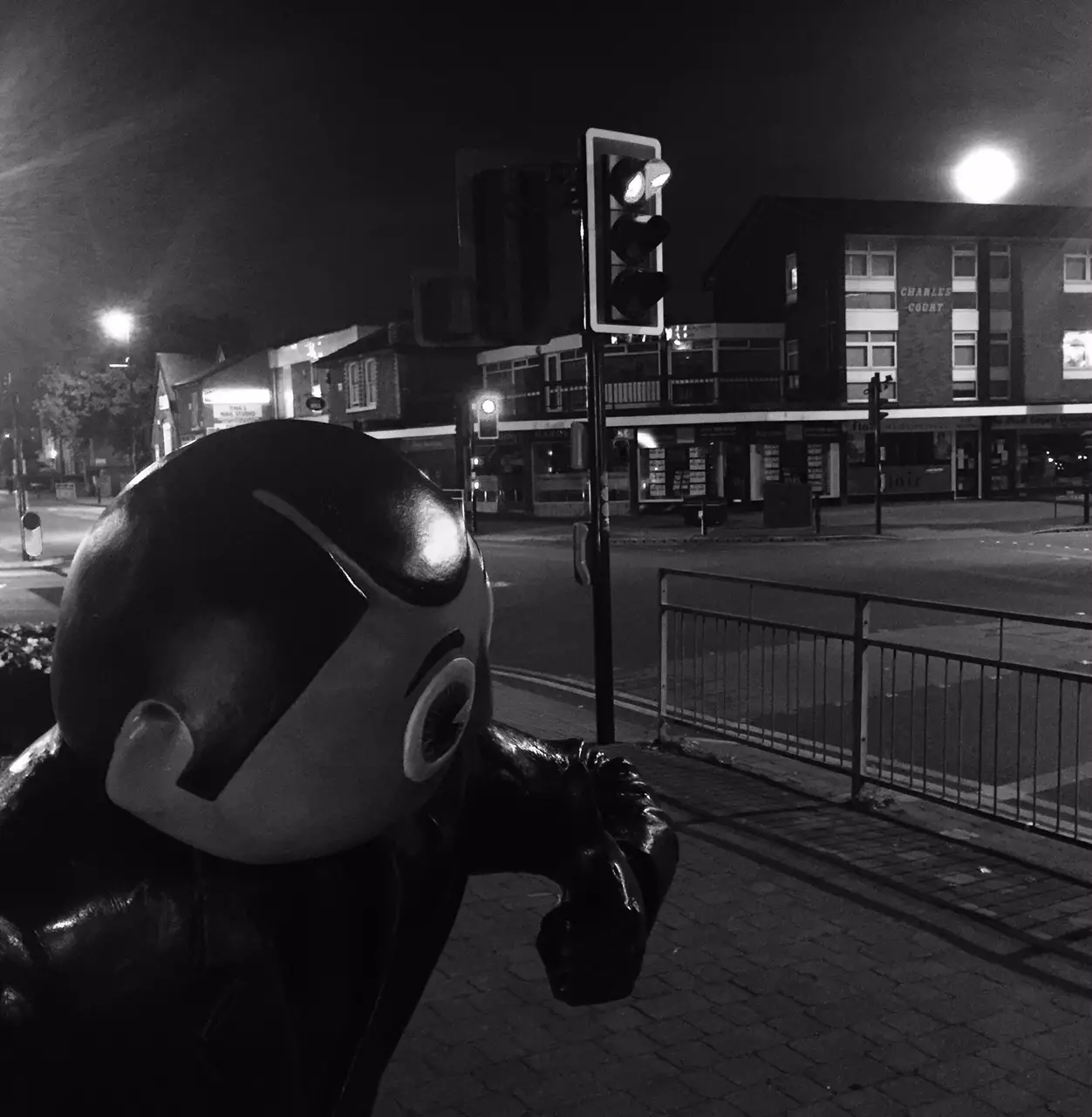 Frank Sidebottom's statue in Timperley village, with Sunday's supermoon in the night sky 