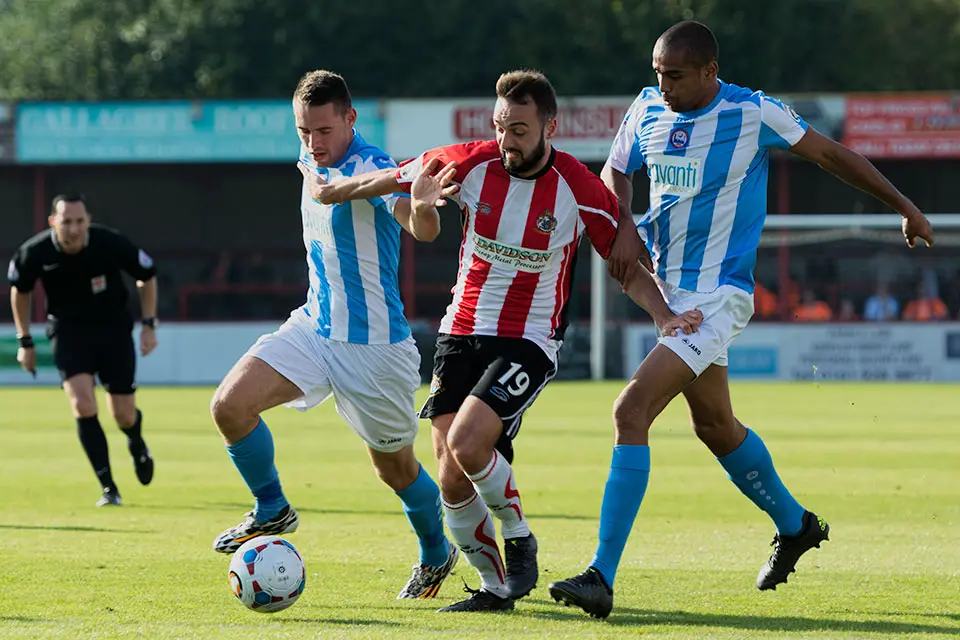 Ryan Crowther takes on two players in the home defeat to Braintree