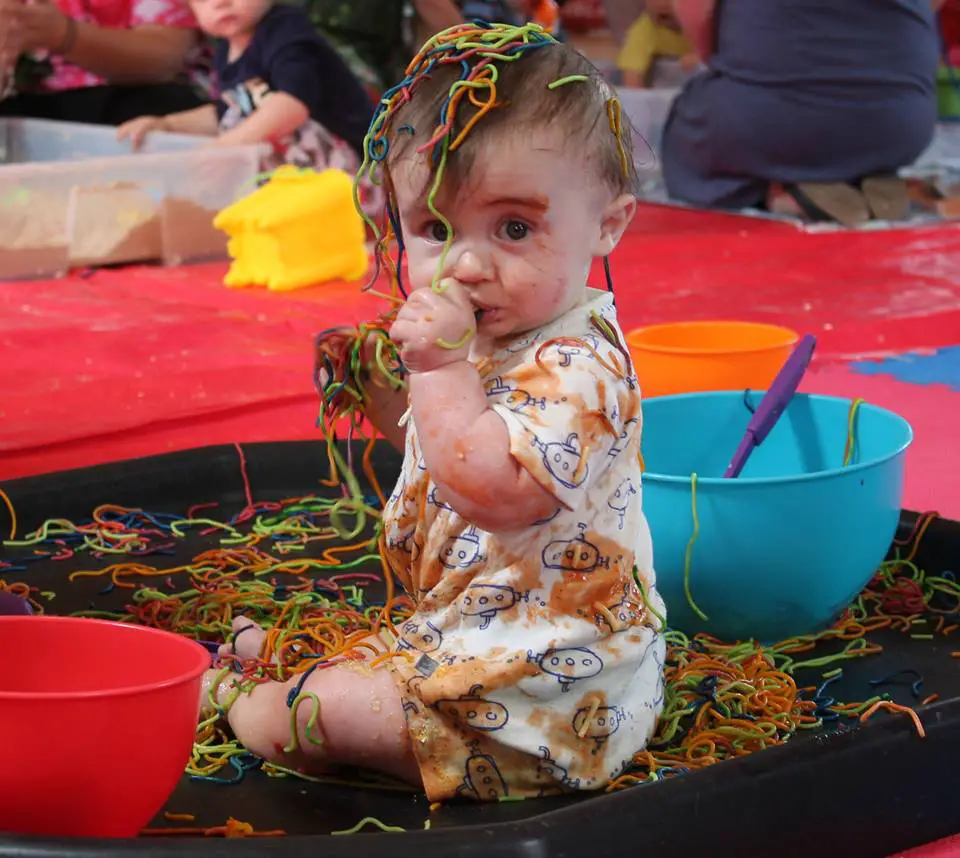 A very messy child at a Mess Around event