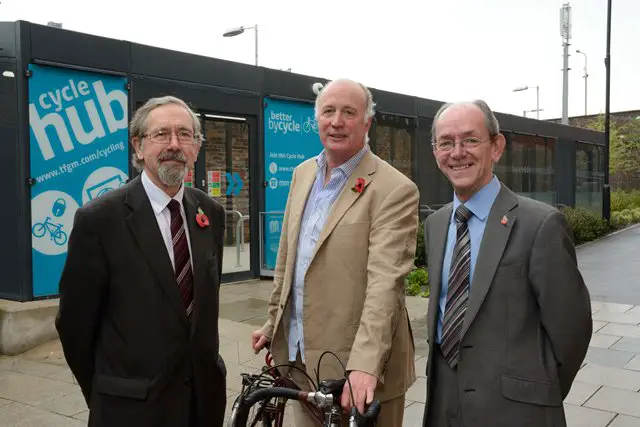 TfGM's Cllr Andrew Fender and Cllr Chris Paul with Trafford Council's Cllr John Reilly at the launch of Altrincham Cycle Hub