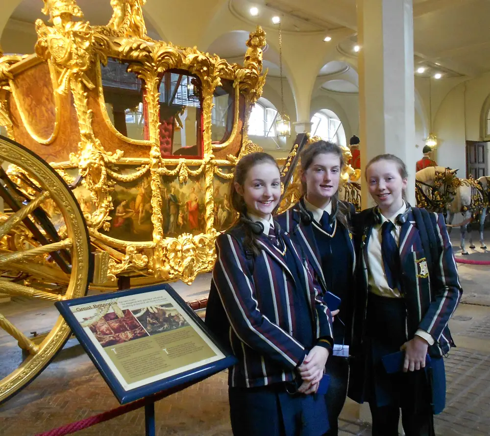Emma, Lucy and Josie inside Buckingham Palace