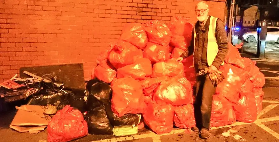 One of the litter volunteers with some of the bags collected