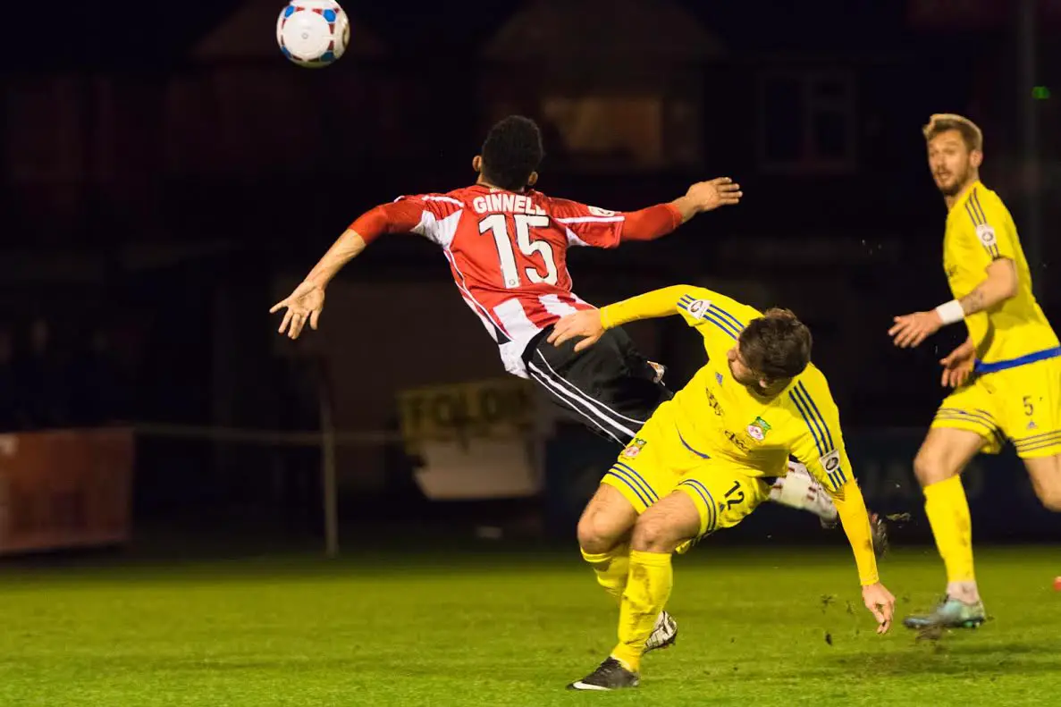 No penalty is given as Josh Ginnelly is sent flying in the box
