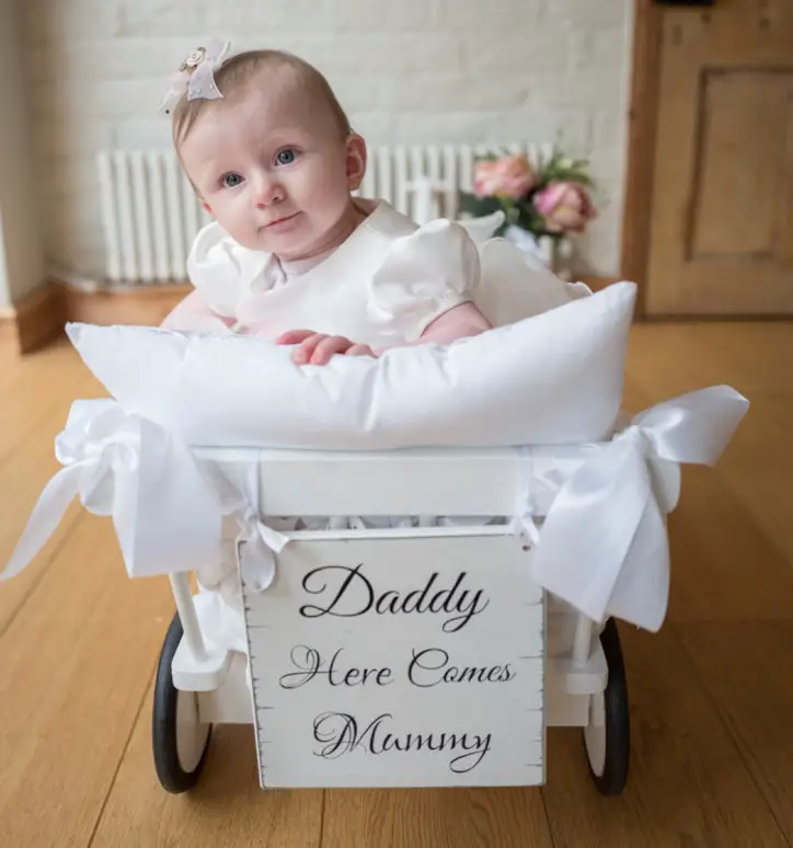 The couple's daughter Darcy in her own baby carriage