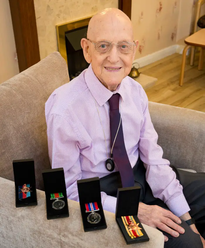 Victor with his long-awaited medals