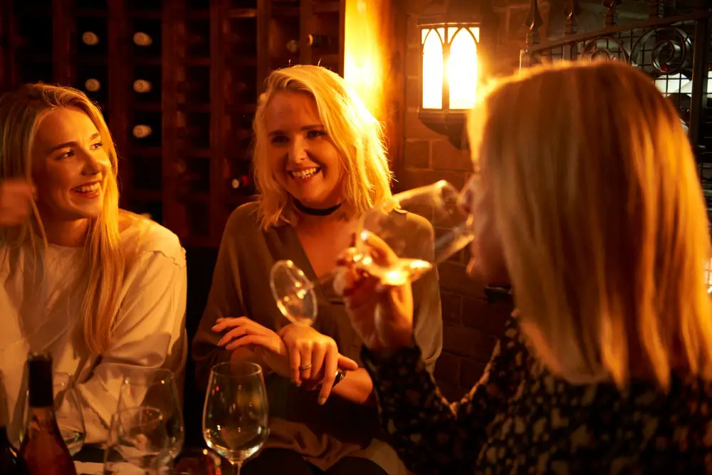 Customers enjoying a wine tasting in the cellar