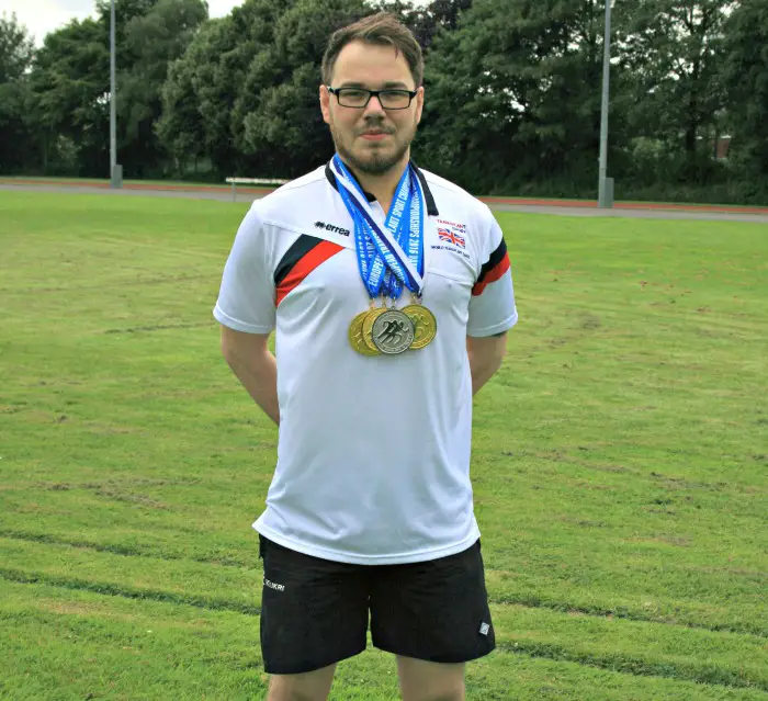 Sam with his medals