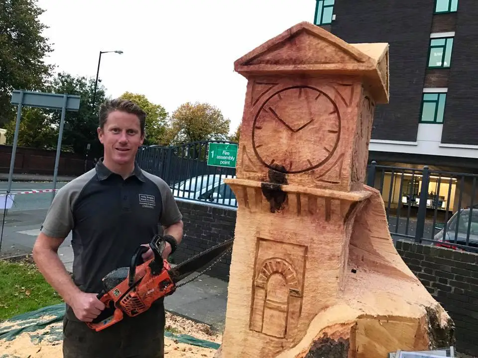 Sculptor Andy Burgess halfway through the carving