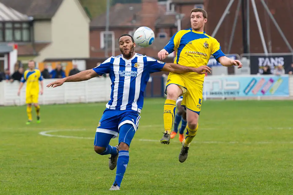 Phil Marsh (right) challenges for the ball