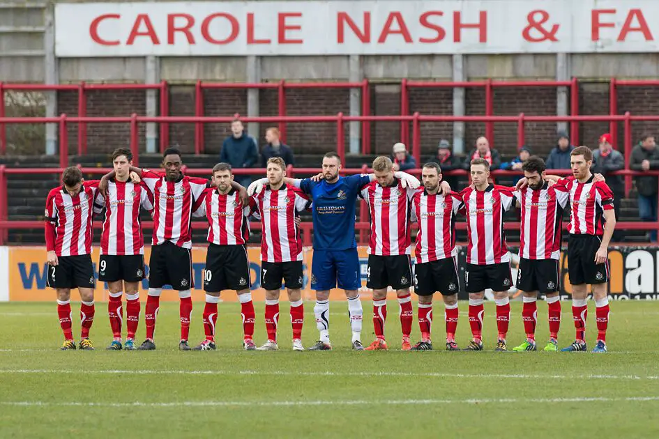 The Robins observe a minute's silence before Saturday's home defeat to Tamworth