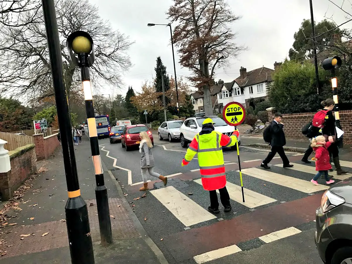 A school crossing patrol at work on Park Road in Timperley