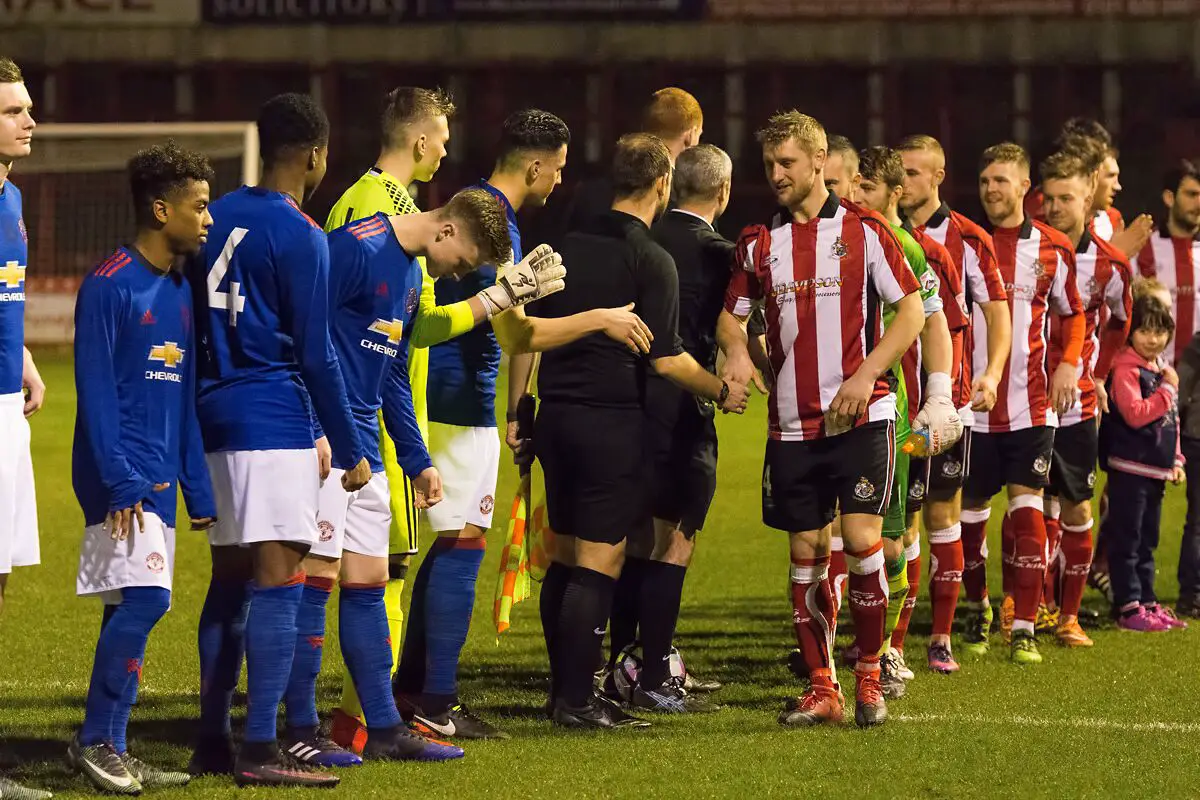 The Alty players shake hands before their game against Manchester United Under-18s on Tuesday