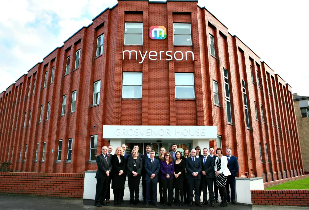 Myerson staff outside the new office